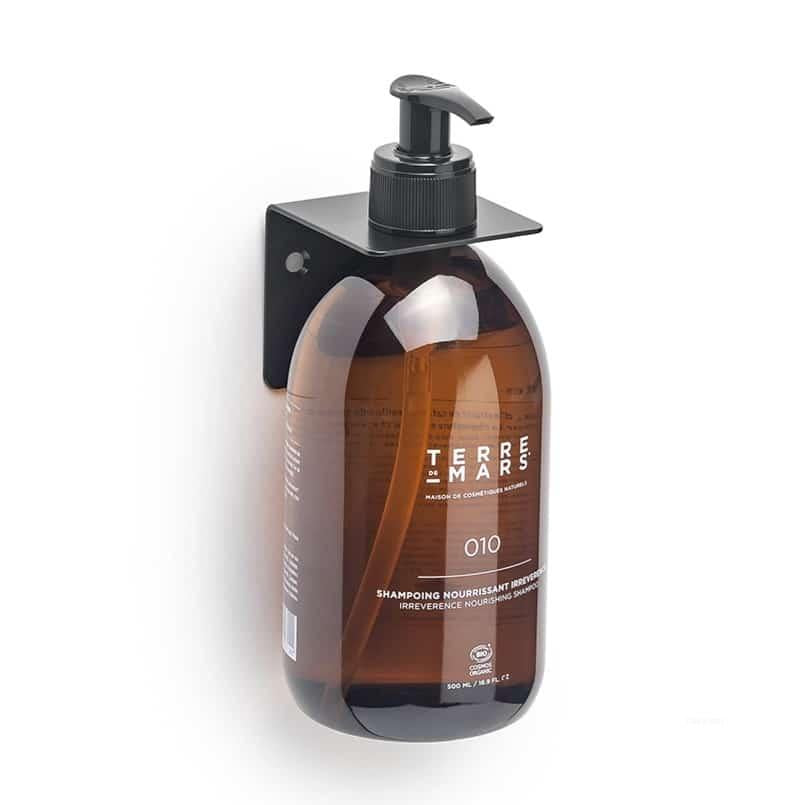 Wall-mounted stainless steel bottle holder for 500ml Terre de Mars bottles.